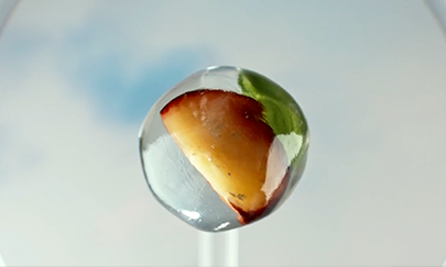 Non alcoholic drink , Fruit and ice fall into glass. A still from a Seedlip advert with a bespoke music composition by Volophonic Ltd.