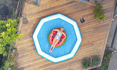 Woman In Paddling Pool From Above