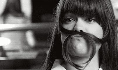 Volophonic Bespoke Music Composition - Woman makes hair into moustache