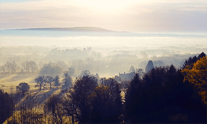 Volophonic Bespoke Music Composition - Misty English country side drone shot
