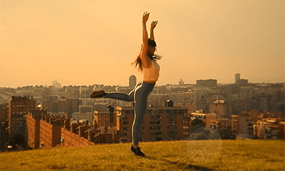 Volophonic Bespoke Music Composition - Woman dances on hilltop overlooking city